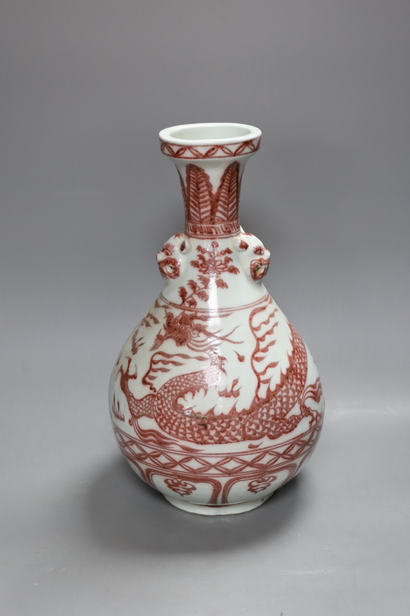 A Chinese vase with dragon decoration in underglaze copper, 35cm